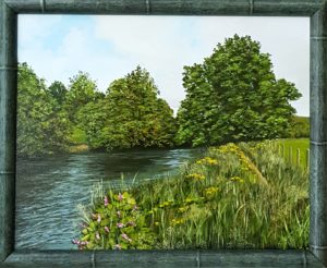 Gerahmte Landschaft mit Wiese am Wasser